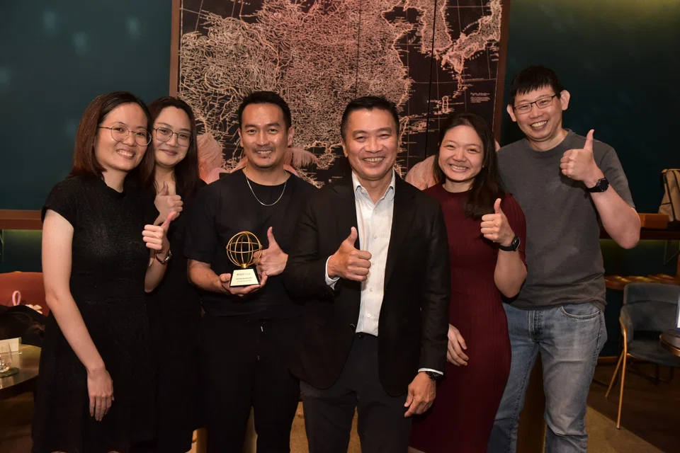 From left: Visual journalist Hannah Kwah; web developer Quah Kai Yuan; executive artist Hyrie Rahmat; SGX chief executive Loh Boon Chye; ESG correspondent Wong Pei Ting, and deputy news editor Kenneth Lim.