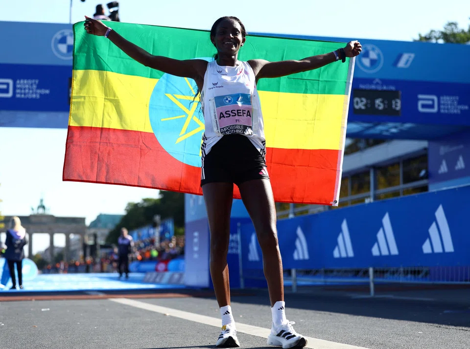 Ethiopia's Tigist Assefa after winning the women's Berlin Marathon on Sunday (Sep 24). Wearing Adidas' newest running shoes, the Adizero Adios Pro Evo 1, she shaved more than two minutes off the world record.