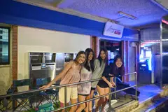 (From left) Polytechnic student Nellie Titus and her friends Rebekah Loh, Megan Choy and Lynette Saw turned up at Lim Ah Pin Post Office in Kovan on Wednesday at 10.30 pm.