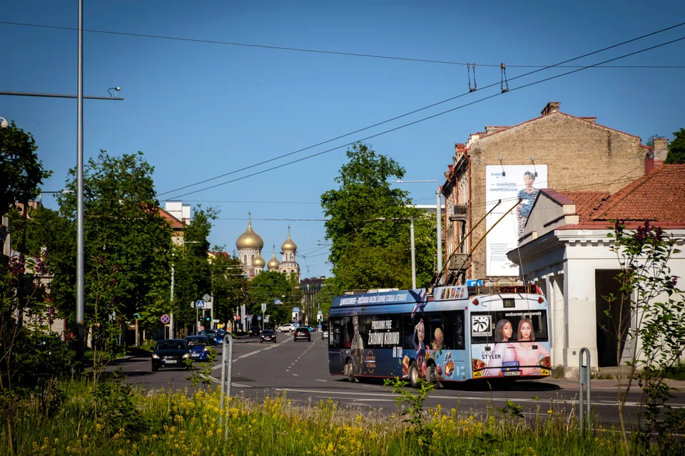 A trolly bears an advertisement for the game maker Nordcurrent in Vilnius, Lithuania, on May 23, 2022. The company's employees from Ukraine say their new home city is easy to navigate. 