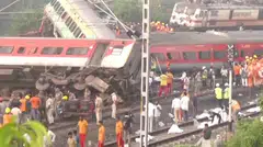 Rescue workers and police officers work next to mangled train carriages, following a deadly collision of two trains, in Balasore, India June 2, 2023, in this still image obtained from a video. ANI/Reuters TV via REUTERS THIS IMAGE HAS BEEN SUPPLIED BY A THIRD PARTY. NO RESALES. NO ARCHIVES INDIA OUT. NO COMMERCIAL OR EDITORIAL SALES IN INDIA
