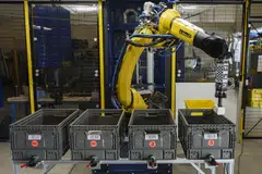 The robotic arm, tipped by a set of retractable suction devices, is called Sparrow. 