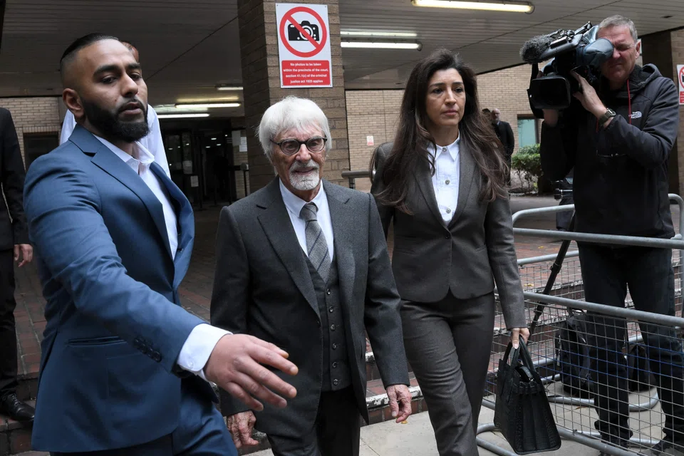 Ex-Formula One chief Bernie Ecclestone (centre) leaving Southwark Crown Court on Tuesday (Oct 4); he is accused of having made an “untrue or misleading” representation to the British tax authority between July 2013 and October 2016.