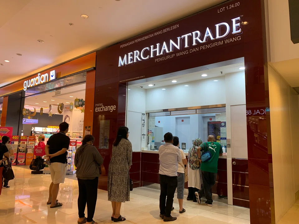 Shoppers lining up at a money changer in Pavilion Kuala Lumpur. In the year-to-date, the ringgit has depreciated close to 3.5 per cent against Singdollar and over 5 per cent against US dollar.