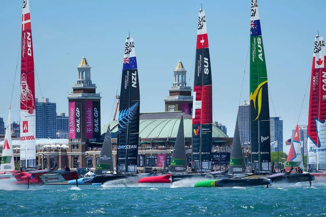 The fleet sailing past spectators at Navy Pier on Race Day 1 of the Sail Grand Prix in Chicago in June 2022. 