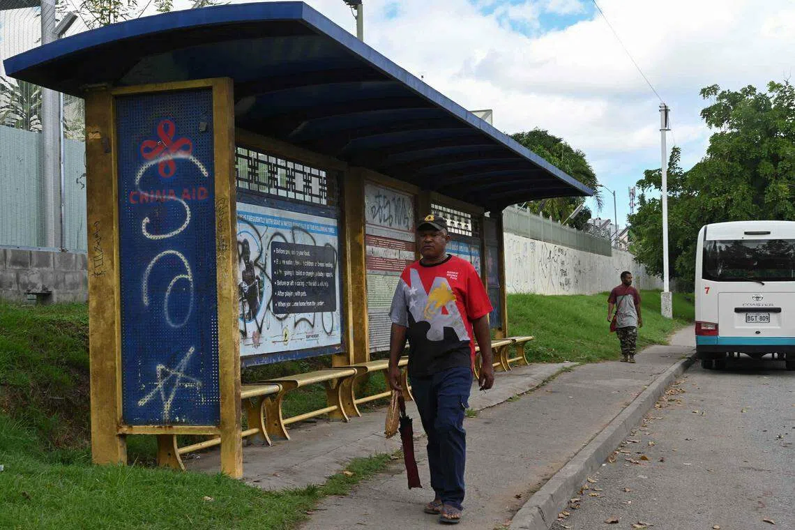 Bus stops with Chinese signage built for the 2018 Apec summit dot Port Moresby.