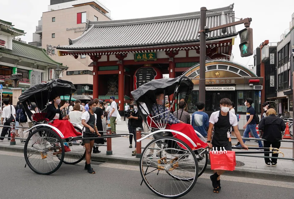Tourists take ride on a rickshaw, or jinrikisha, at Asakusa, downtown Tokyo, Japan, Sept 7 2022. The Japan government is planning to waive tourist visa requirements from some countries, Fuji News Network reported on Monday.