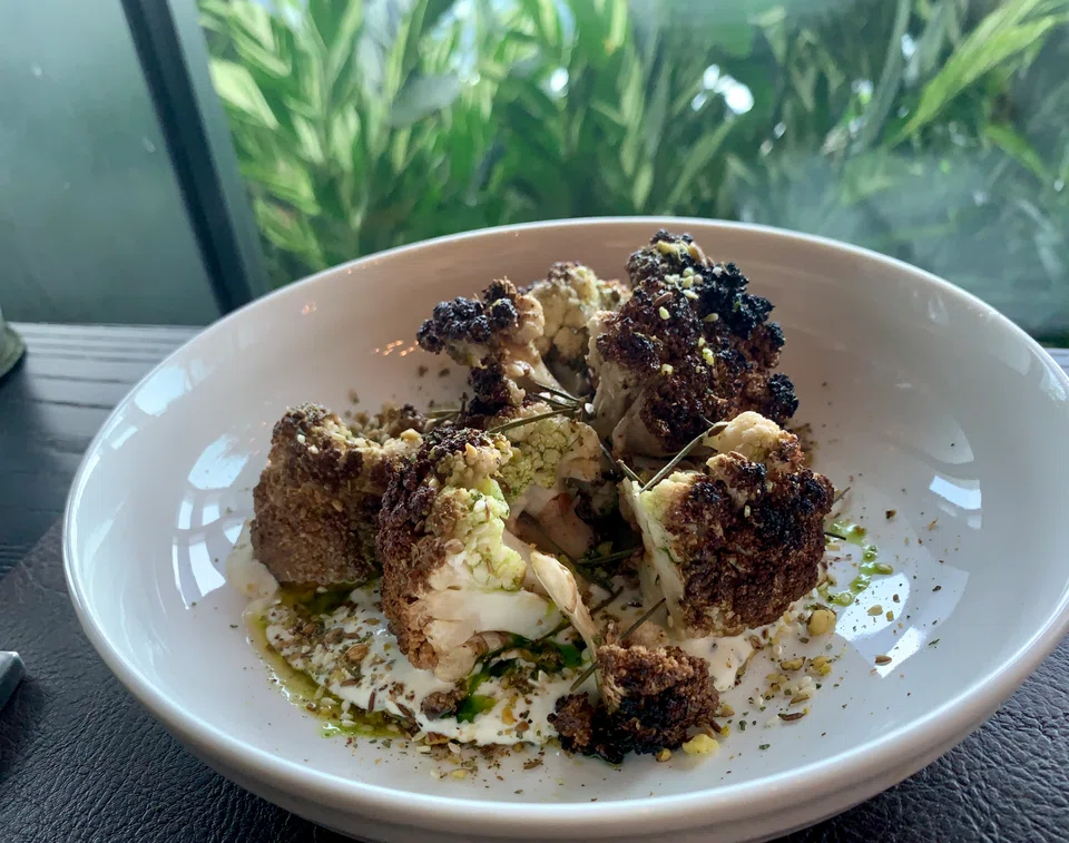 Roasted cauliflower on yoghurt cream sauce.