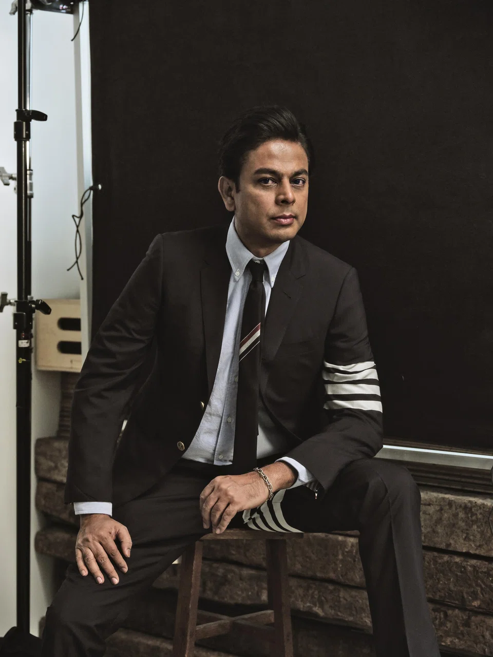Anurag Srivastava in shirt, suit & tie by Thom Browne.