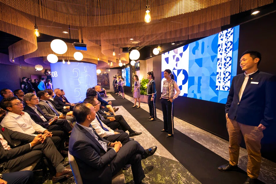 UOB's brand refresh event included a fashion show, which featured staff walking down the runway with the bank’s new branch ambassador uniforms.