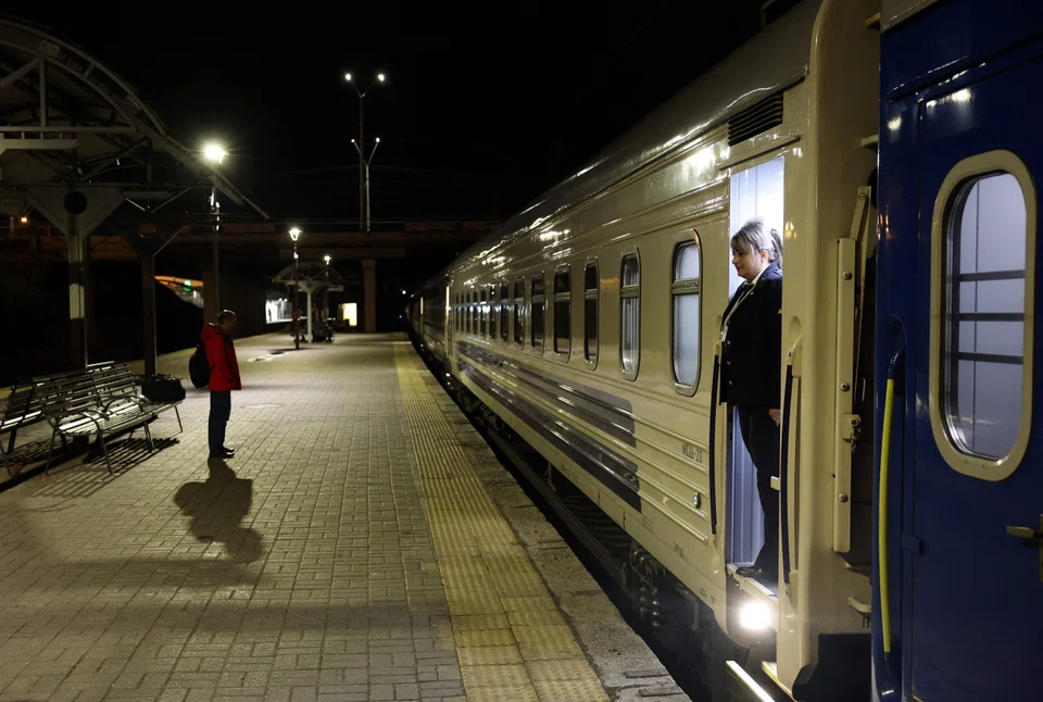 Ukrainian train hostess Tetyana Kogut (right) has taken on an unlikely role, welcoming and catering to countless VIPs travelling to show their support for Kyiv