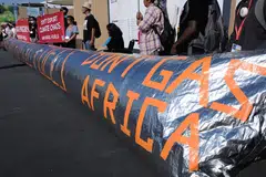 Activists holding a demonstration to implore countries to phase out all fossil fuels at the COP27 climate summit in the Red Sea resort of Sharm el-Sheikh, Egypt, on Friday (Nov 18).  Egypt is keeping a tight lid on demonstrations by requiring permits. 
