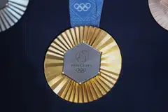 The Chaumet-designed Paris 2024 Olympic gold medal features a hexagon-shaped piece of iron taken from the original Eiffel Tower. 
