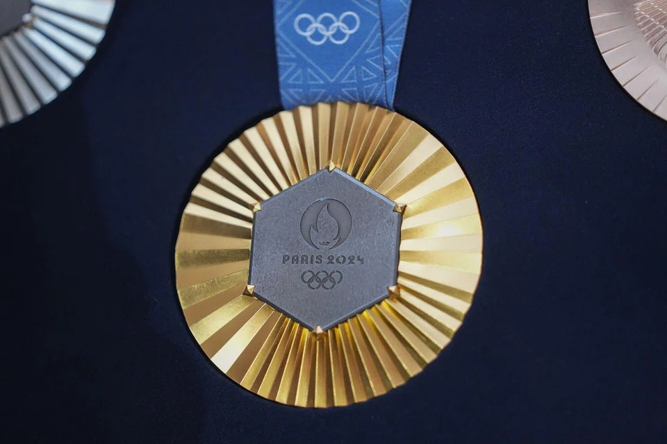 The Chaumet-designed Paris 2024 Olympic gold medal features a hexagon-shaped piece of iron taken from the original Eiffel Tower. 