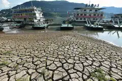 This photo taken on Aug 16 shows a section of a parched river bed along the Yangtze River in China's southwestern Chongqing. A severe drought has shrunk rivers, disrupting the region’s supply of water and hydropower, and prompting officials to limit electricity to businesses and homes.