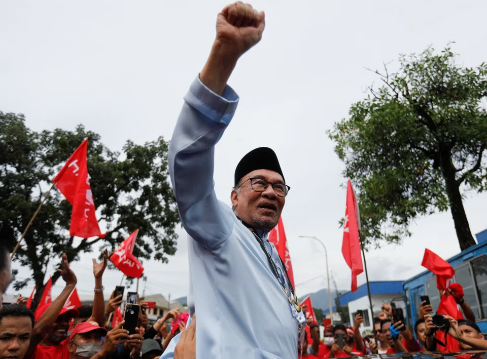 Malaysia's opposition leader Anwar Ibrahim gestures to his supporters after he filed his nomination to contest in Malaysia's general election at Tambun, Perak, Malaysia Nov 5, 2022. 