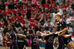 Bayern Munich's Frans Kratzig (right) celebrating after netting an injury-time winner against Liverpool at the National Stadium in Singapore on Aug 2.