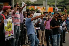 Trade union members shout anti government slogans during a protest in Colombo, Sri Lanka, 27 July 2022. Trade union members stage a protest calling for the resignation of the new president and demanding a fresh parliamentary election. 