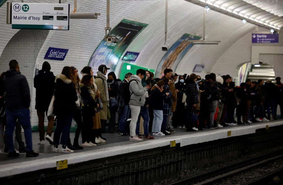 Passengers on a platform during a strike by Paris transport network workers at Saint-Lazare metro station in Paris on Tuesday (Jan 31).  Opinion polls show that most French people oppose the retirement-age reform, but President Emmanuel Macron and his government intend to stand their ground.  