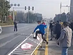 Workers at Foxconn’s iPhone factory in Zhengzhou in central China clashing with riot police. 