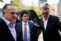 Bankman-Fried (centre) will appear in a federal New York court on Tuesday (Sep 3) facing seven counts of fraud that could see him spend decades in prison.