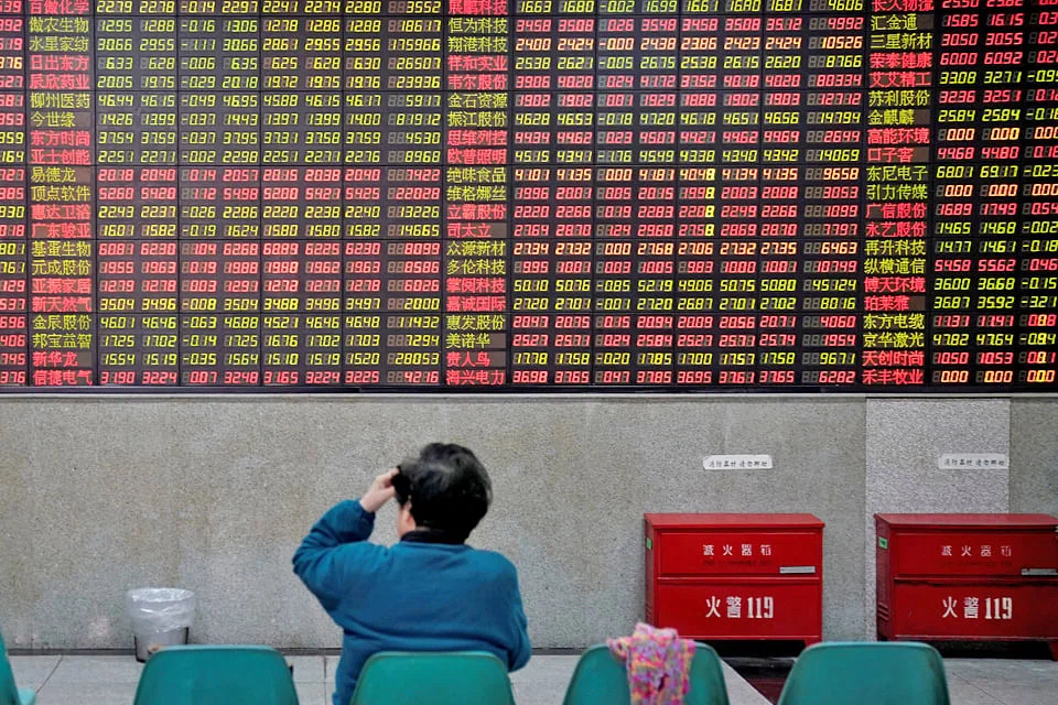Workers at Halcyon Agri faciliy in Palembang, Indonesia. Natural rubber is formed into blankets as part of the process of making Standard Indonesian Rubber.