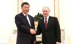 Russian President Vladimir Putin and Chinese President Xi Jinping attend a meeting at the Kremlin in Moscow,  Mar 20, 2023. Russia is presenting Xi’s trip, his first since securing an unprecedented third term this month, as evidence that it has a powerful friend in its standoff with a hostile West.