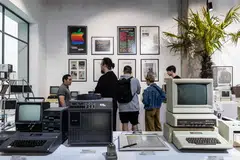 People visit the newly opened Apple Museum in Warsaw, Poland. The museum sets out to tell the story of the development of consumer electronics through the "successes and failures" of Apple.