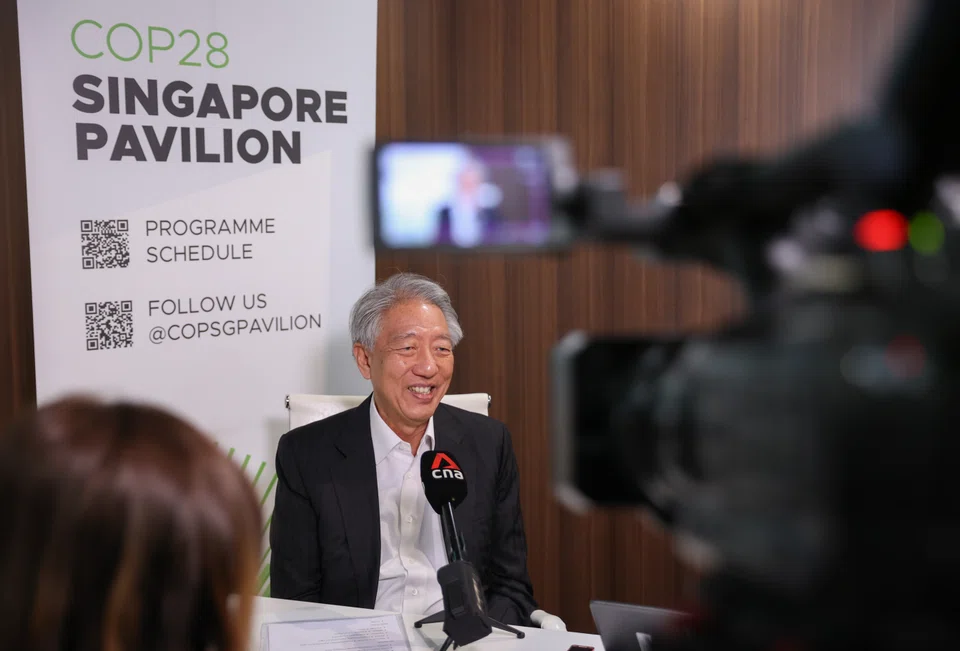 Senior Minister Teo Chee Hean speaking to media at the sidelines of the United Nations climate change conference in Dubai on Tuesday (Dec 5). 