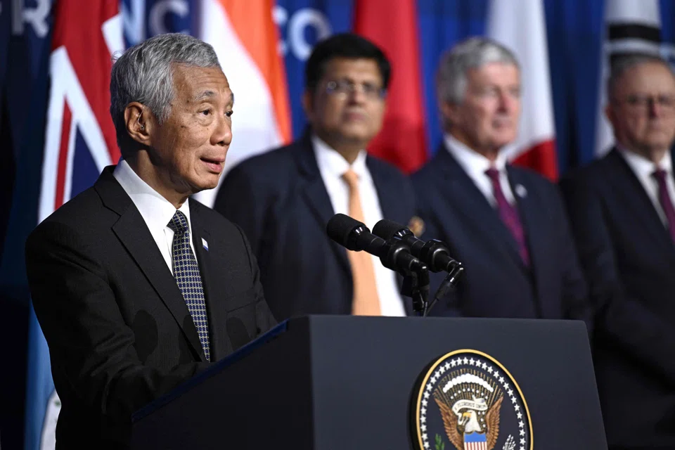 Prime Minister Lee Hsien Loong delivering remarks alongside members of the Indo-Pacific Economic Framework for Prosperity.