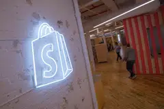 Shopify is in talks to buy technology startup Deliverr, according to people familiar with the matter, a move that would help the Canadian e-commerce company expand in fulfillment services. 
