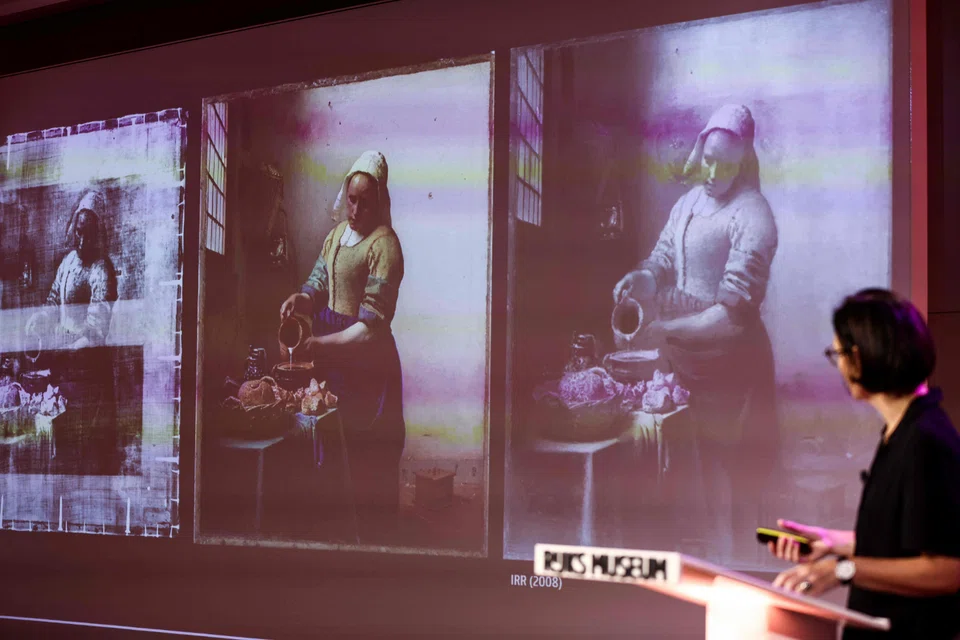 Advanced scanning techniques revealed that beneath the plain white wall that makes the milkmaid’s bright yellow and blue clothes stand out, Vermeer had originally painted extra details.