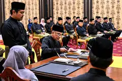 Malaysia's newly appointed Prime Minister Anwar Ibrahim (centre) takes part in the swearing-in ceremony at the National Palace in Kuala Lumpur on Thursday (Nov 24).  
