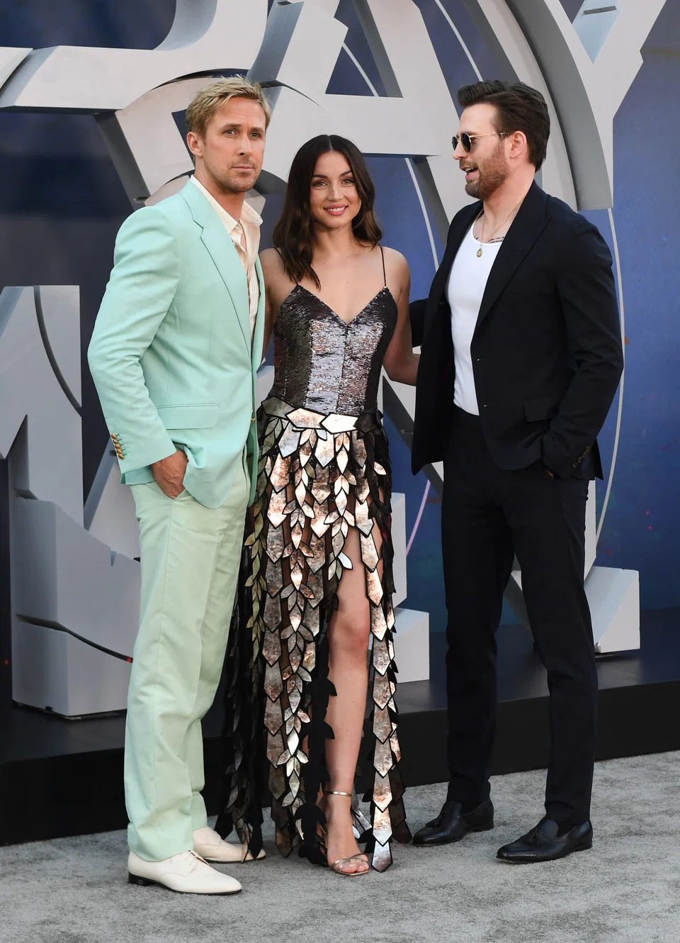 Left to right: The Gray Man stars Ryan Gosling, Ana de Armas and Chris Evans attend Netflix’s world premiere event of the movie in Hollywood on Jul 13.