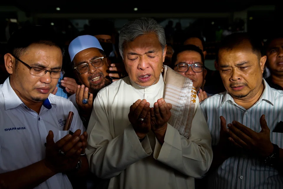  Former Malaysia deputy prime minister Ahmad Zahid Hamidi is accused of receiving about US$11 million in bribes from a company to win government contracts over a foreign visa system. 