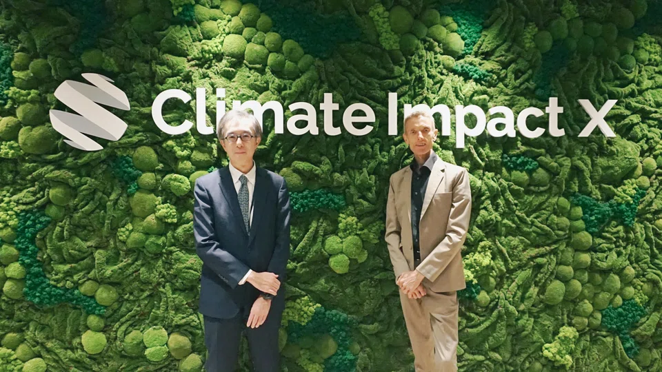 Mizuho Financial Group's group chief sustainability officer Yasuhiko Ushikubo (left) with Climate Impact X chief executive officer Mikkel Larsen at CIX's office. Mizuho will invest in Climate Impact X, joining its founding shareholders DBS Bank, SGX Group, Standard Chartered and GenZero, a decarbonisation investment platform founded by Temasek.