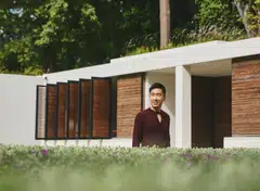 Bino Chua in Fendi knitted pullover and trousers.