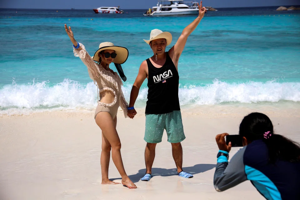 Tourists on a beach at an island in Phang-Nga province, Thailand. The Bank of Thailand has predicted 29 million tourist arrivals this year, still below the nearly 40 million visitors in pre-pandemic 2019.
