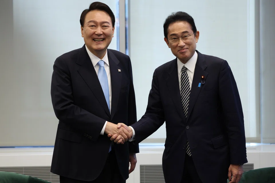 South Korean President Yoon Suk Yeol (left) and Japanese Prime Minister Fumio Kishida pose for a photo prior to their talks as they meet on the sidelines of the UN General Assembly, in New York, Sept 21, 2022.  