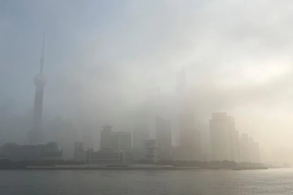 The Oriental Pearl Tower and other buildings in Lujiazui financial district shrouded in fog amid a red alert for heavy fog in Shanghai, China, Dec 29, 2023.