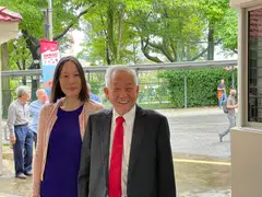 Ng Kok Song and his fiancee Sybil Lau arriving at the Elections Department shortly past 10.30 am on Wednesday to pick up an application form for the certificate of eligibility.