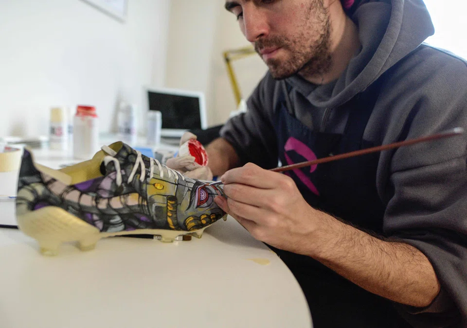 Satja Grabuloski works on his new sneakers in his workshop in Skopje. More than 300 celebrities are his customers, including Lebron James and Dua Lipa. 