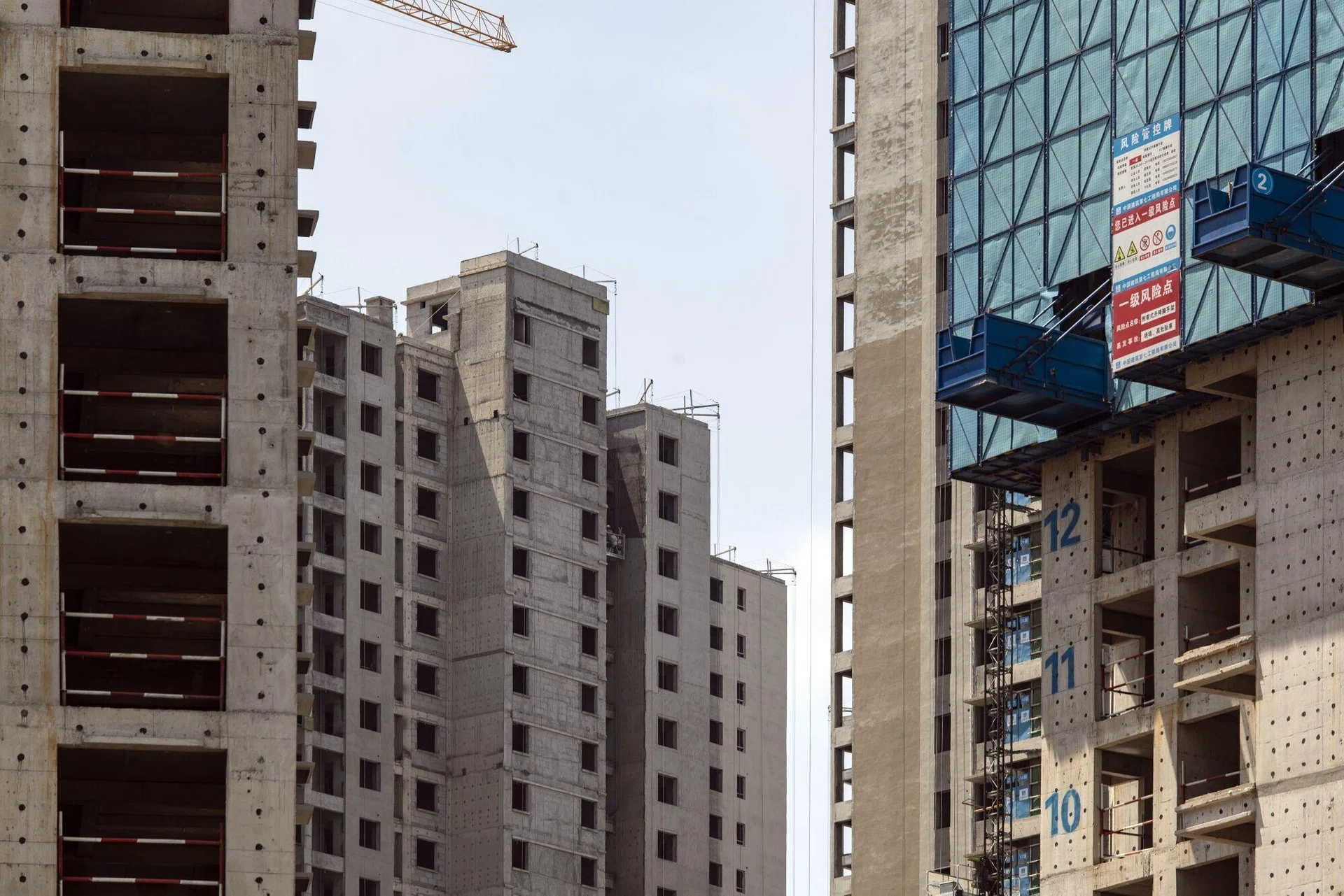 Giant cracks in road spark evacuation of high-rise blocks in China ...