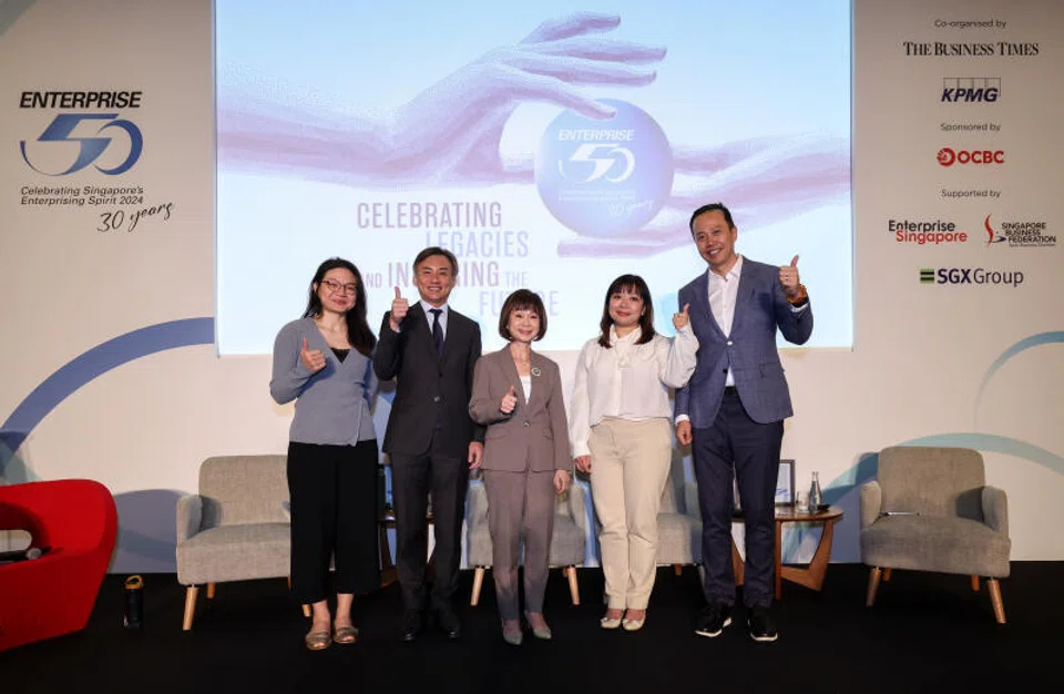 (From left) Wong Pei Ting, correspondent, The Business Times, moderates a panel with participants Mike Ng, group chief sustainability officer, OCBC; Amy Khor, Senior Minister of State for Sustainability and the Environment and Transport; Cherine Fok, partner, head of Our Impact Plan, KPMG in Singapore; Mark Lee, chief executive officer, Sing Lun Holdings.