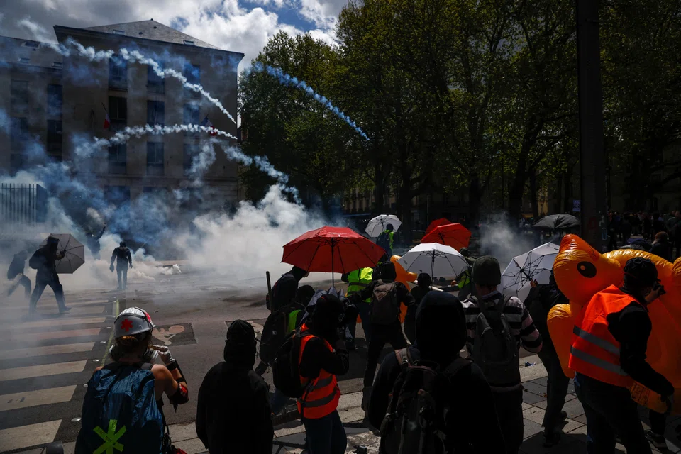 Police firing tear gas in Paris and the western city of Nantes, as protesters joined Labour Day rallies across Europe.