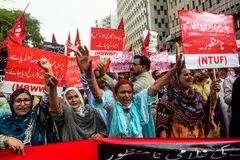 Activists affiliated with various labour unions in a street demonstration against inflation and fuel price hikes in Karachi in June. 