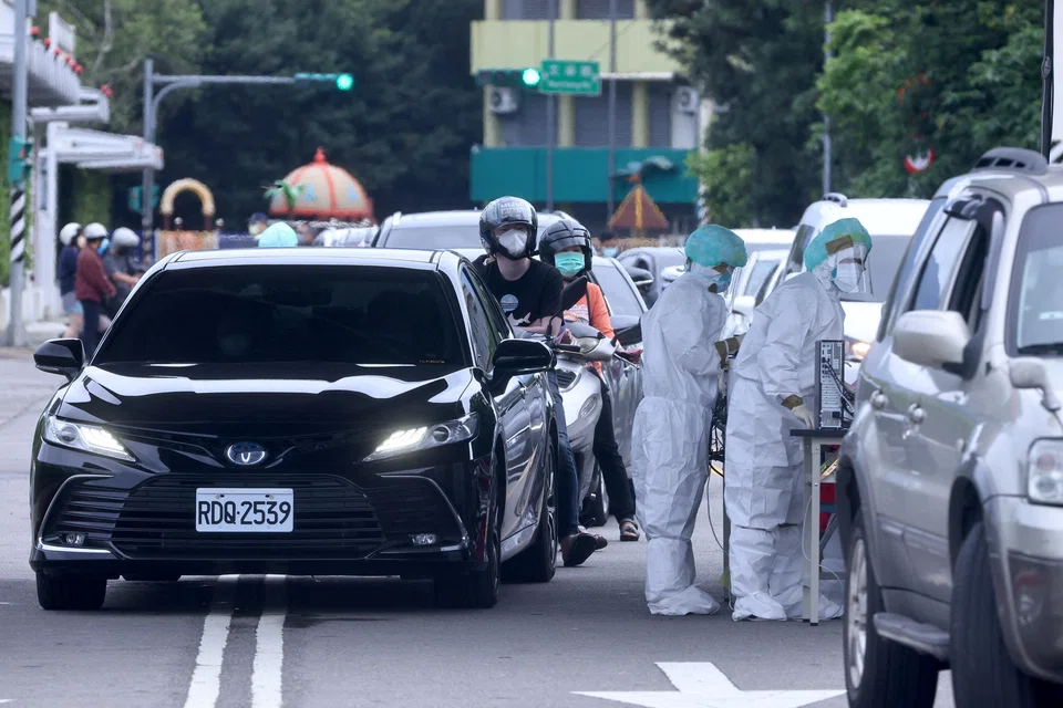 People waiting in the line at a newly opened drive-through Covid test venue in Taipei last week.  