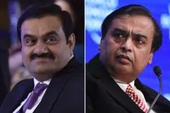 Gautam Adani (left) and Mukesh Ambani are profiting from a surge in global commodity prices triggered by Russia's invasion of Ukraine, burnishing their fossil-fuel credentials even as Asia's richest men publicly push their pivots toward greener energy.
