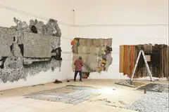 Anatsui’s studio is filled with finished and in-progress works made from bottle caps, foil and wood.Credit.