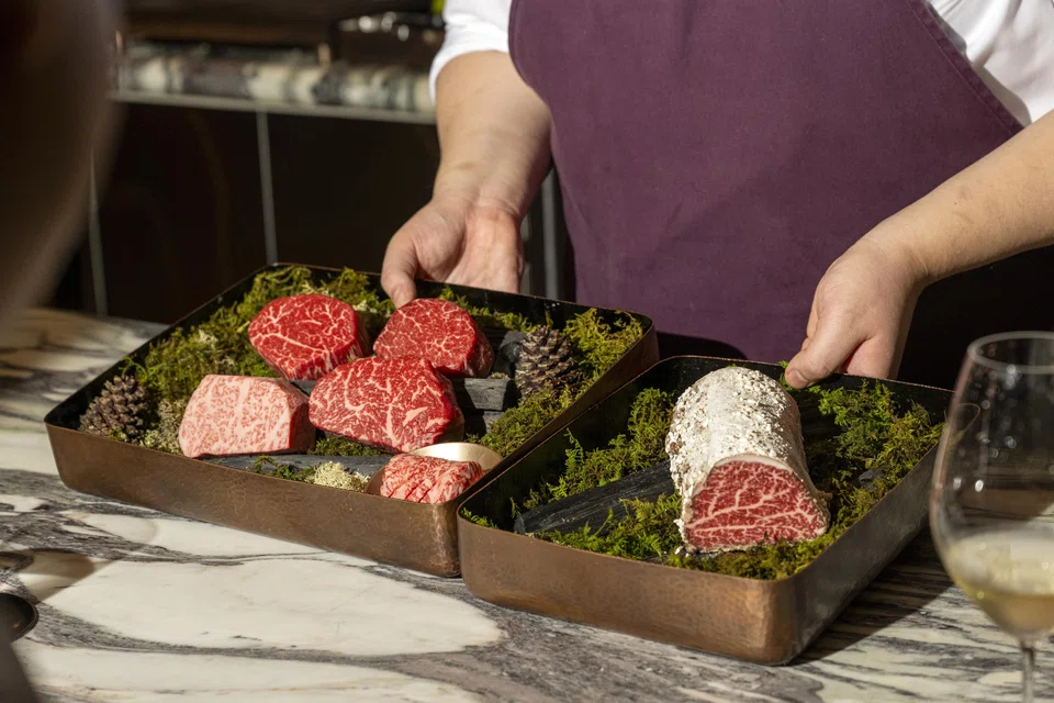 Bom, one of the newest and most expensive Korean restaurants in town, where you pay almost US$300 for about 12 courses that culminate in multiple slabs of Wagyu beef spiderwebbed with rich fat.